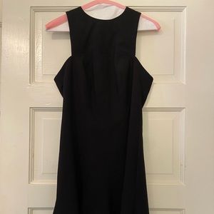 Likely black fit and flare racerback mini dress, good condition size 4